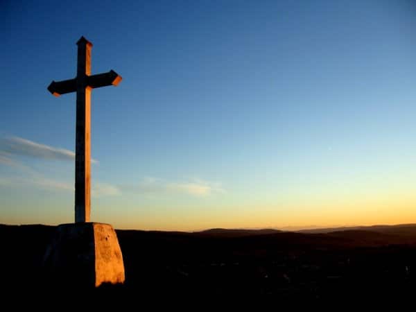 cross and setting sun